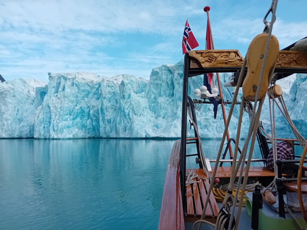 Ocean Sherpa next to an iceberg