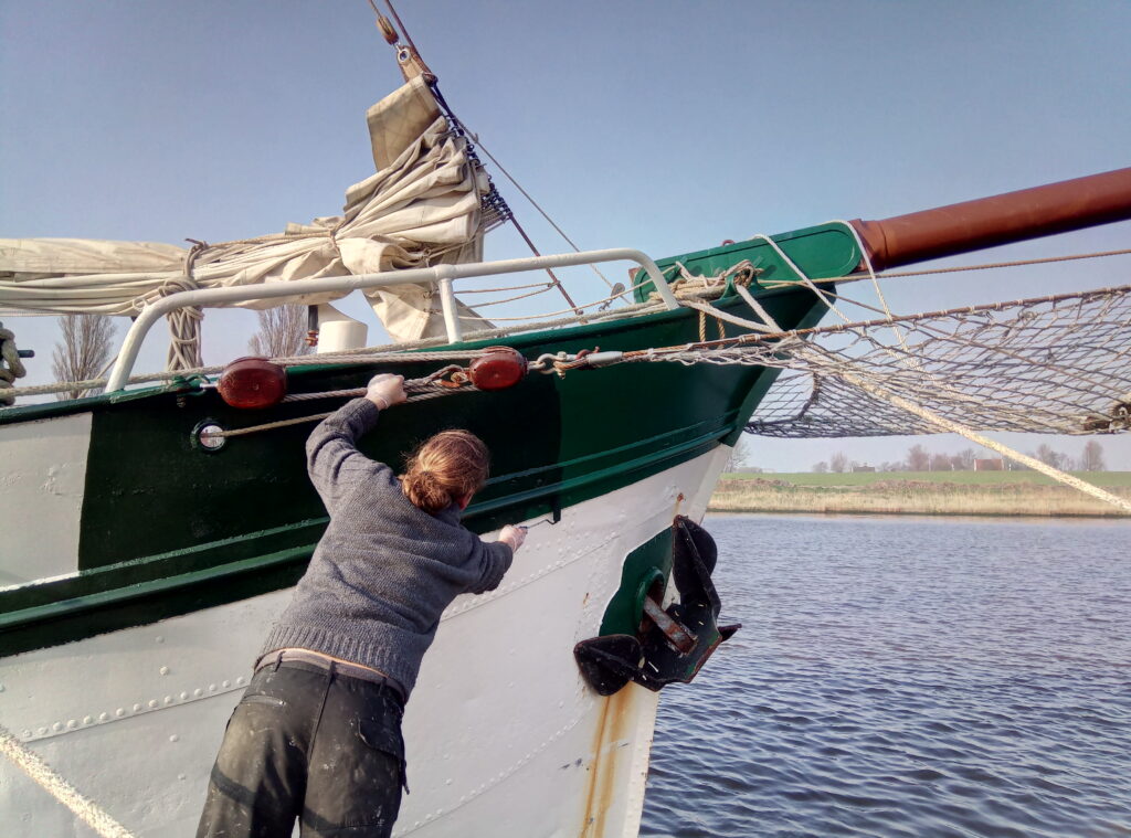 The skipper painting his vessel